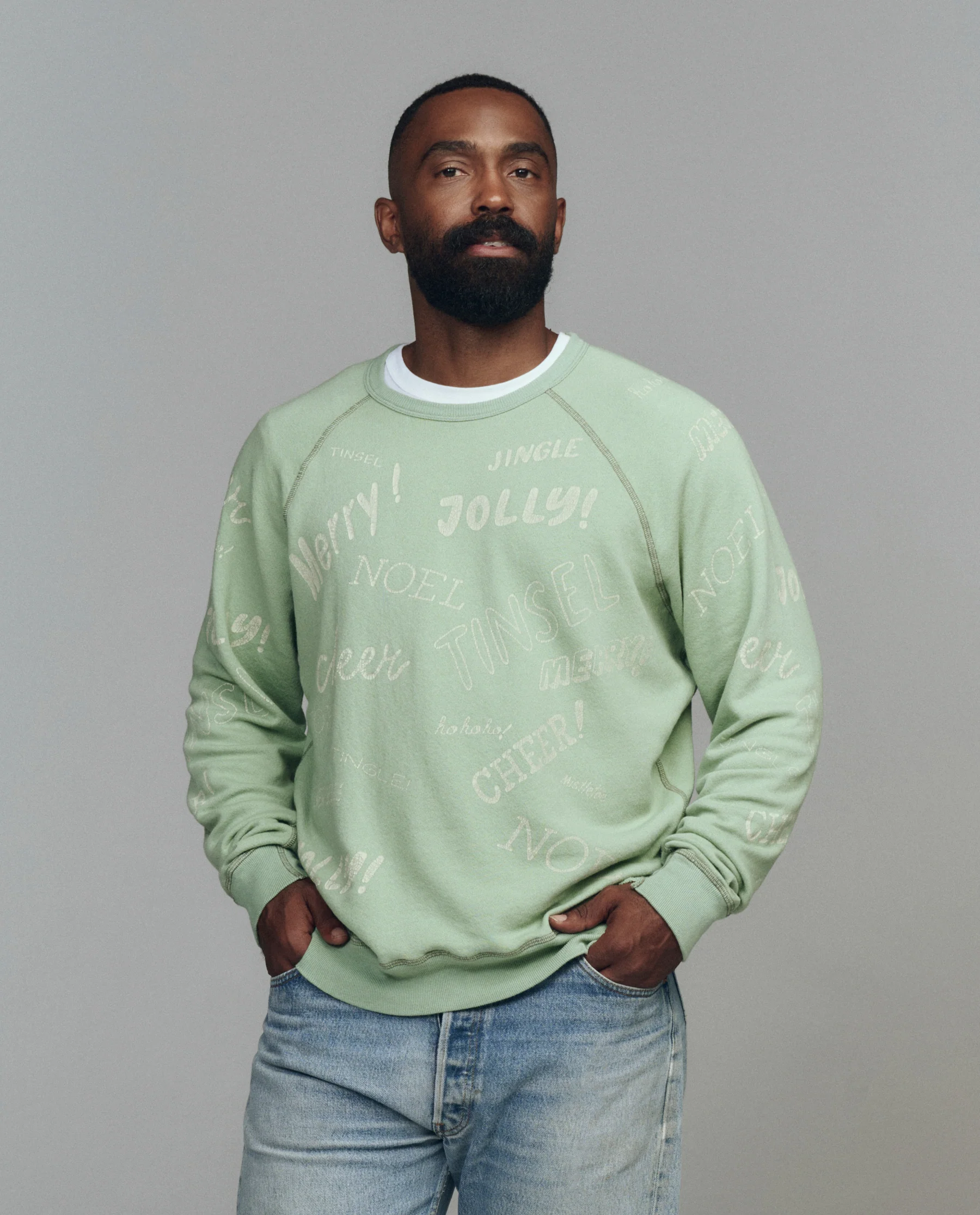 The Men's College Sweatshirt. Graphic -- Vintage Mint with Holiday Greetings Graphic