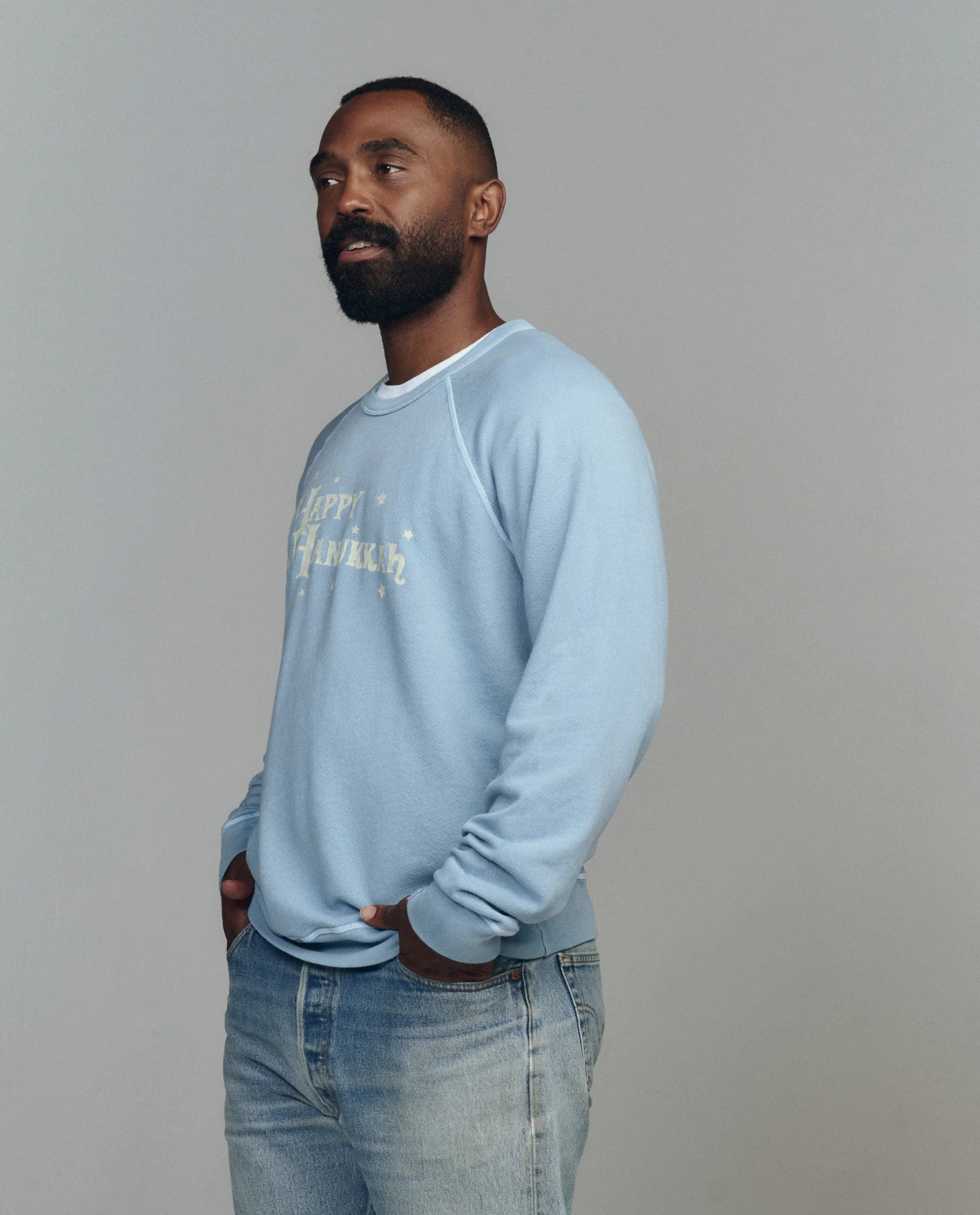 The Men's College Sweatshirt. Graphic -- Confection Blue with Happy Hannukah Graphic