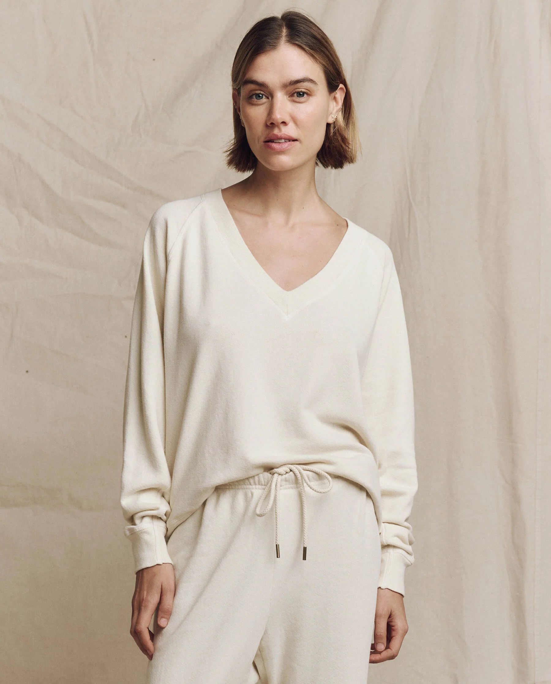 394-the-v-neck-sweatshirt.-washed-white-1.webp The V-Neck Sweatshirt. -- Washed White