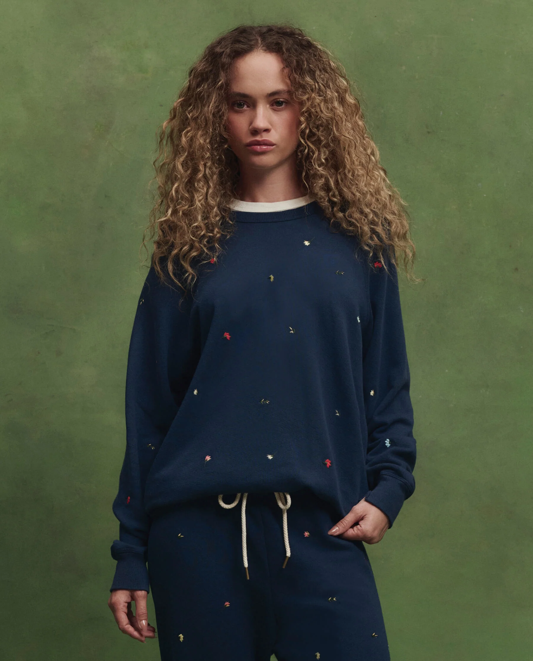 The College Sweatshirt w/ Tossed Floral Embroidery. -- Navy