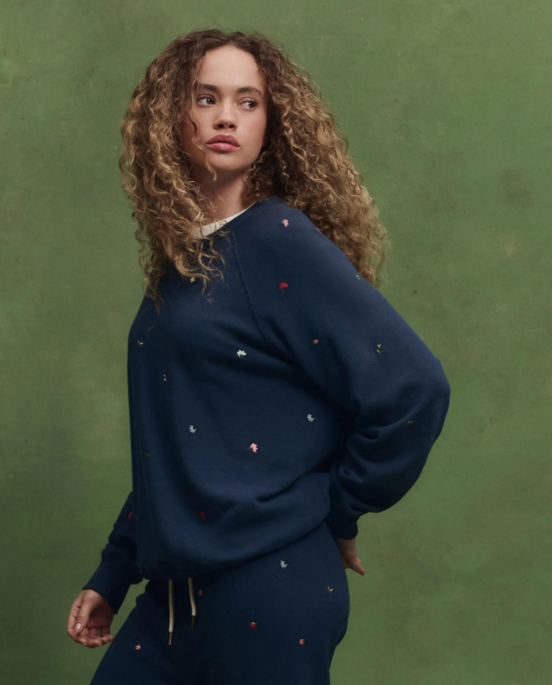The College Sweatshirt w/ Tossed Floral Embroidery. -- Navy