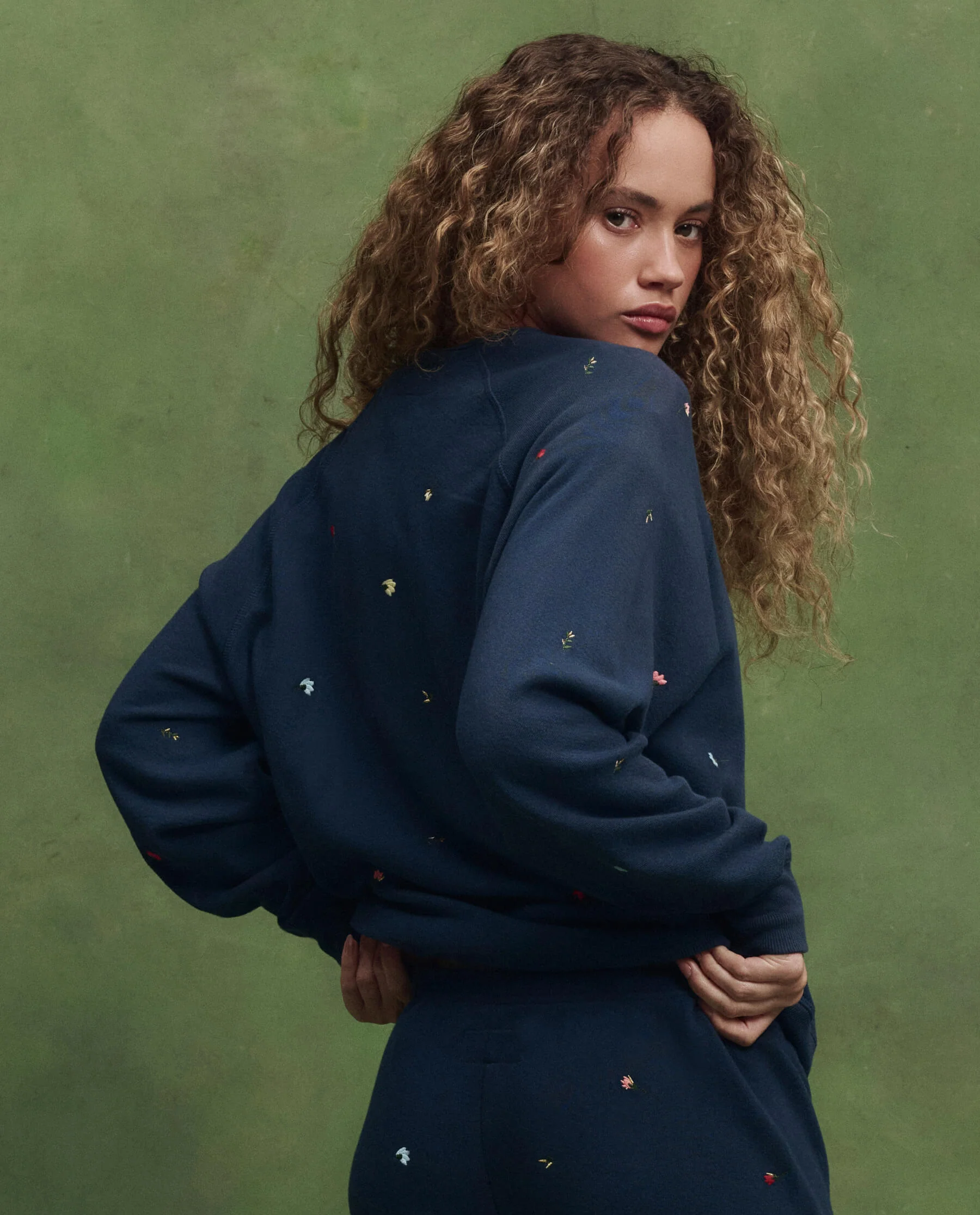 The College Sweatshirt w/ Tossed Floral Embroidery. -- Navy