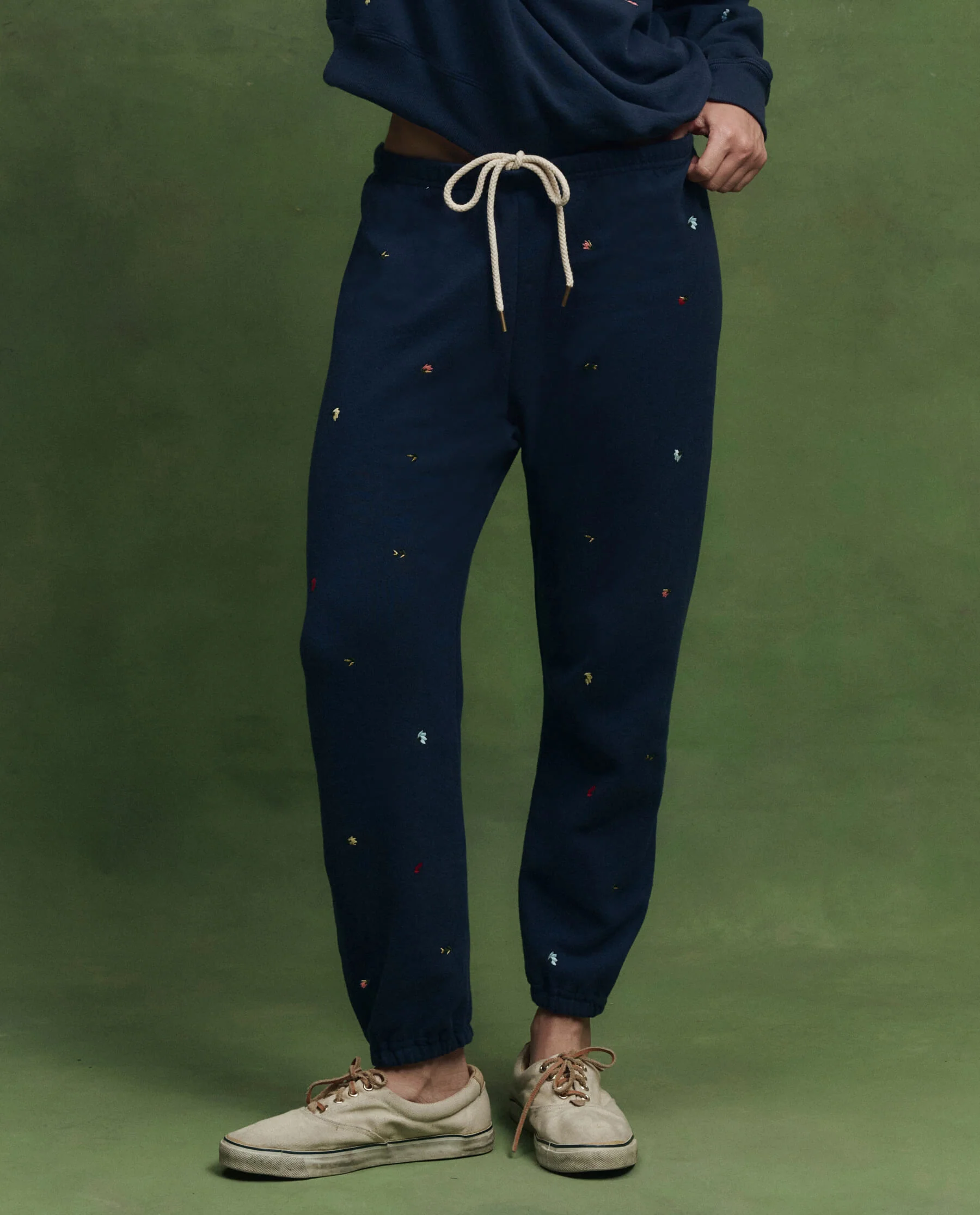The Stadium Sweatpant w/ Tossed Floral Embroidery. -- Navy