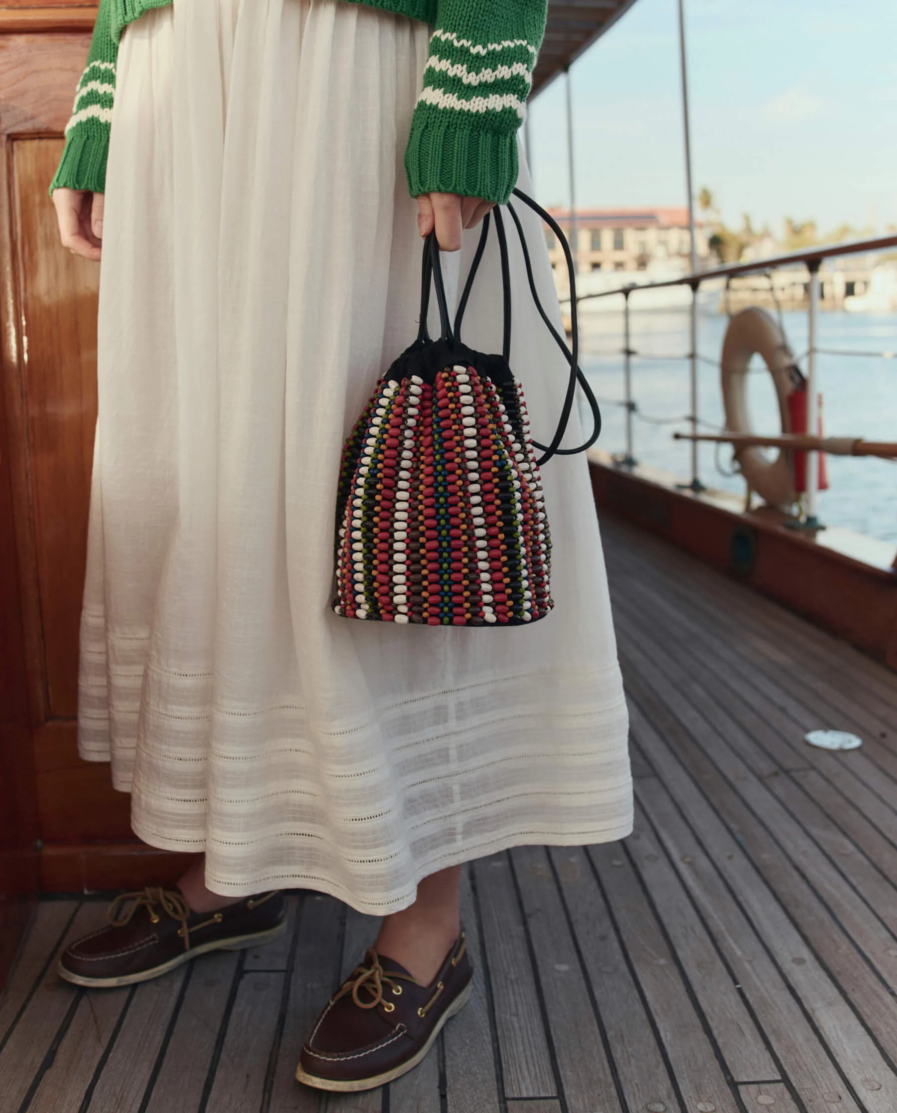 The Beaded Cinched Bucket Bag. -- Cabana Stripe