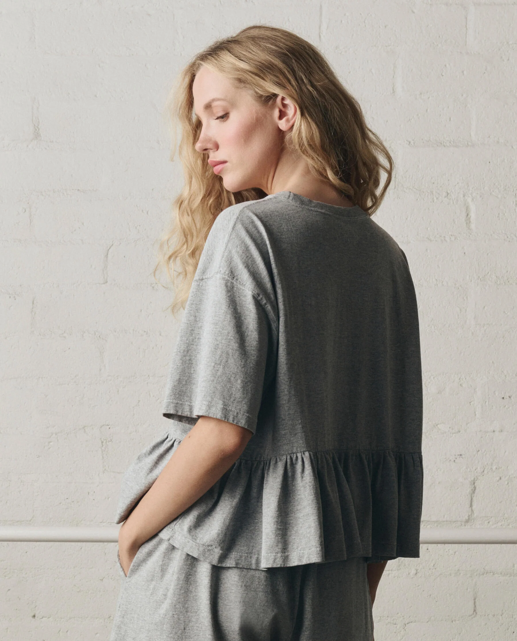 943-the-oversized-ruffle-peplum-tee.-heather-grey-4.webp The Oversized Ruffle Peplum Tee. -- Heather Grey
