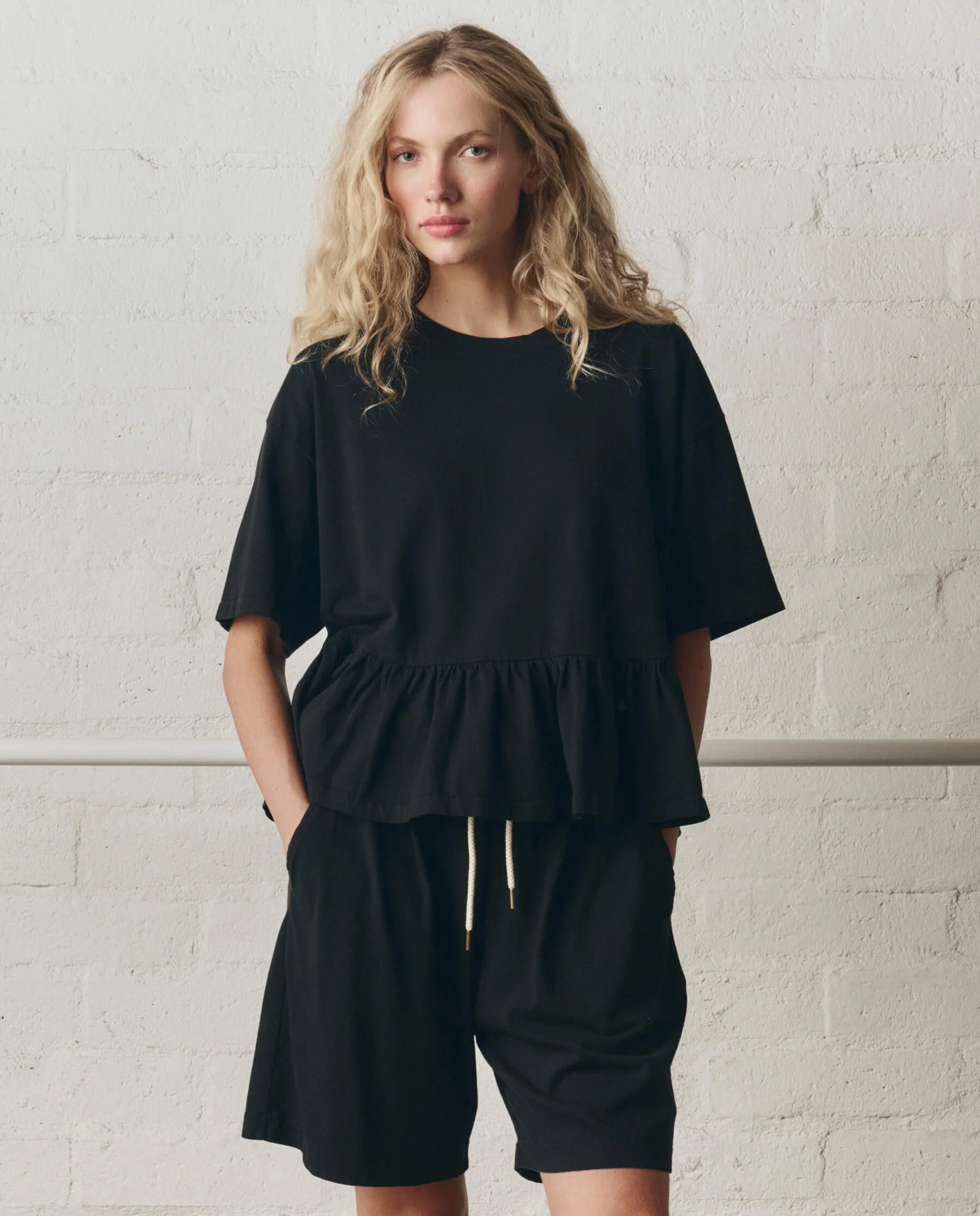 968-the-oversized-ruffle-peplum-tee.-true-black-3.webp The Oversized Ruffle Peplum Tee. -- True Black