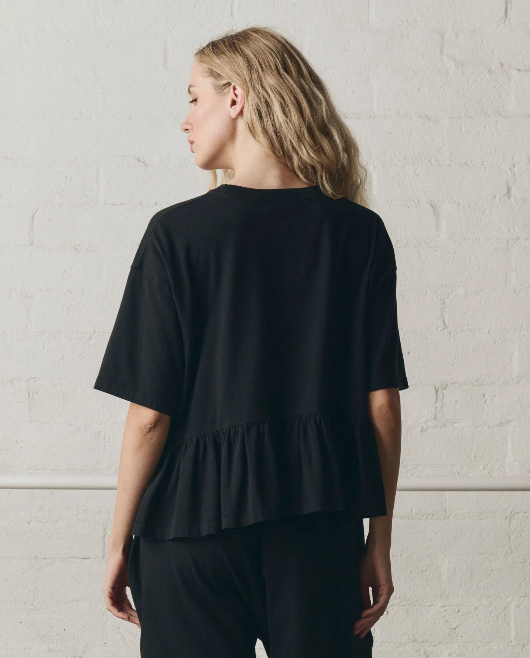 968-the-oversized-ruffle-peplum-tee.-true-black-4.webp The Oversized Ruffle Peplum Tee. -- True Black