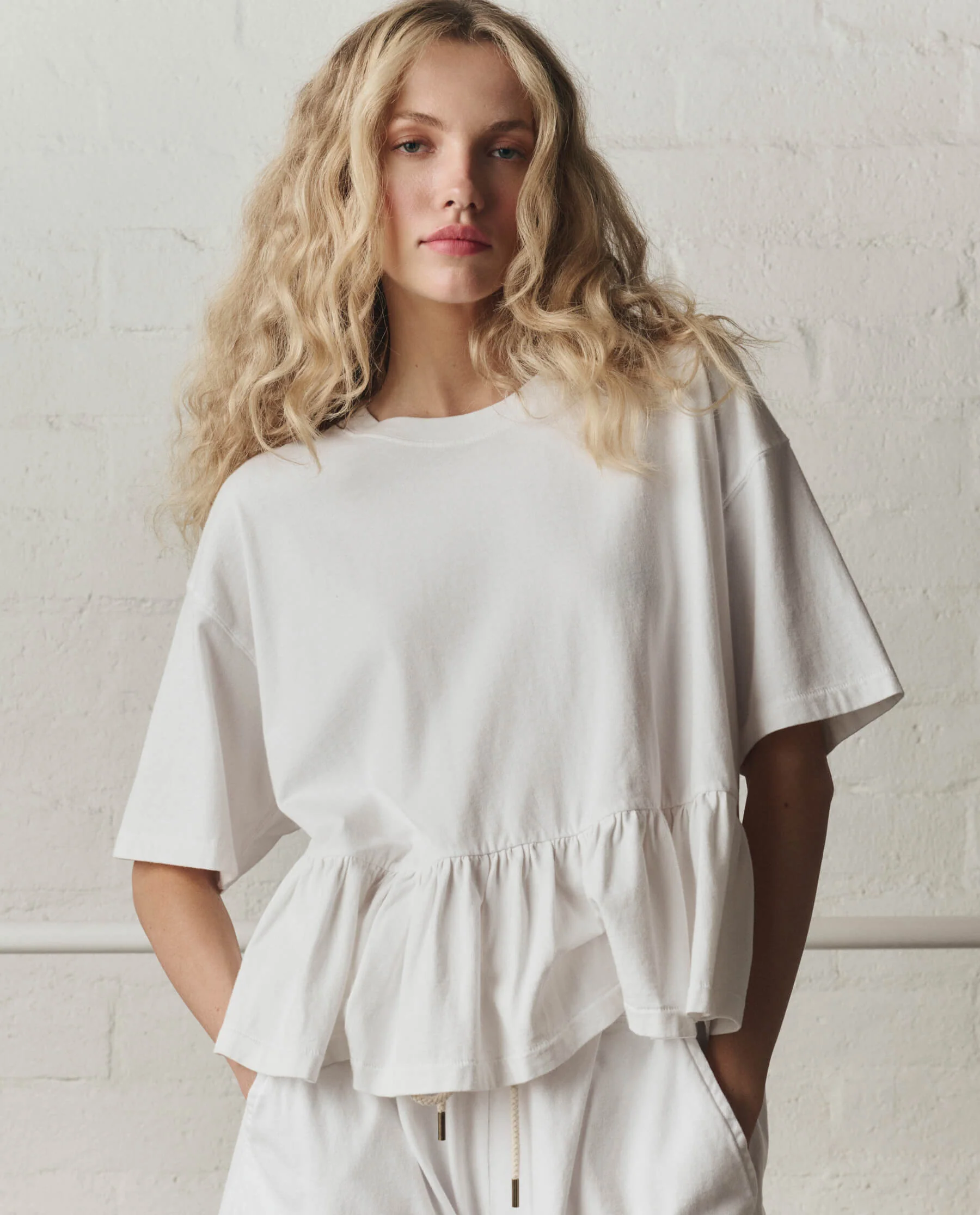 973-the-oversized-ruffle-peplum-tee.-true-white-2.webp The Oversized Ruffle Peplum Tee. -- True White
