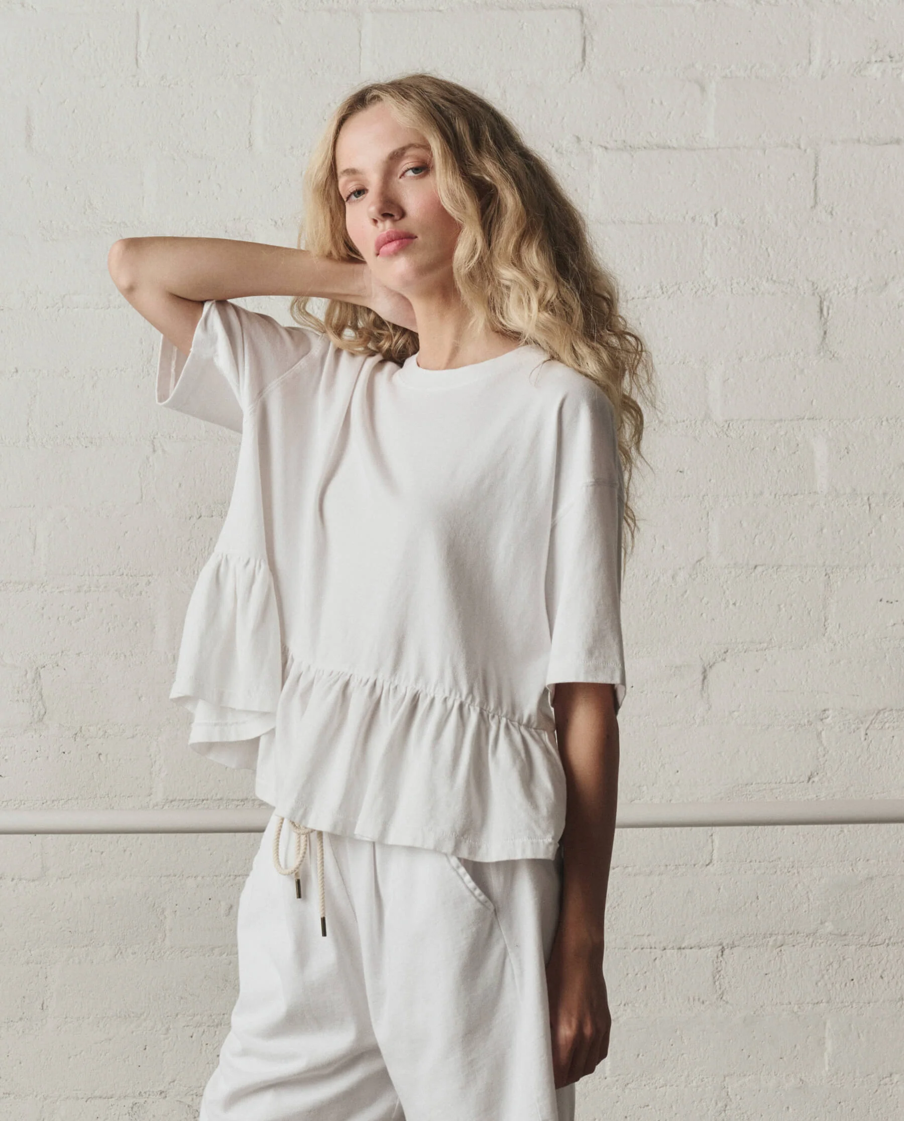 973-the-oversized-ruffle-peplum-tee.-true-white-3.webp The Oversized Ruffle Peplum Tee. -- True White