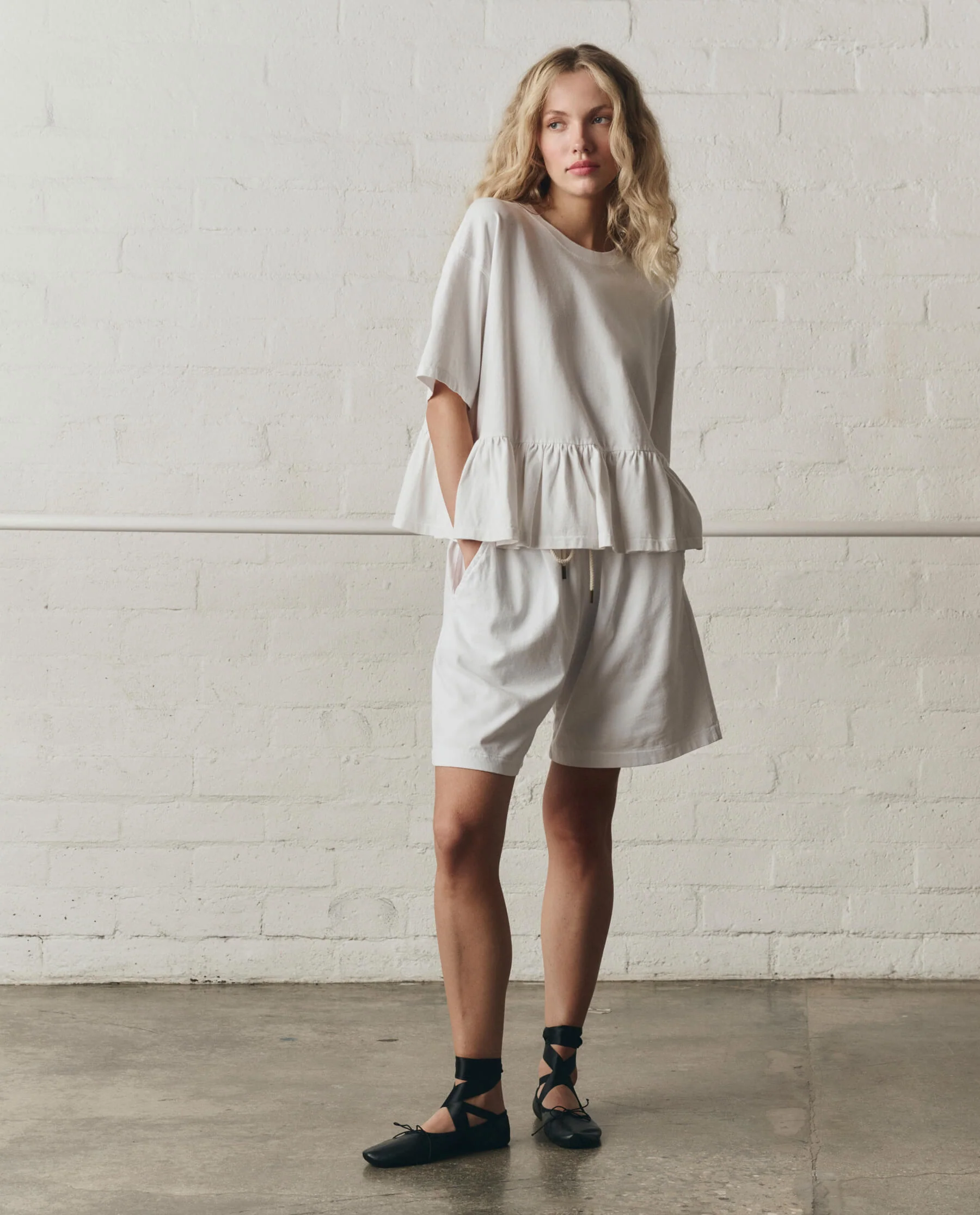 973-the-oversized-ruffle-peplum-tee.-true-white-5.webp The Oversized Ruffle Peplum Tee. -- True White